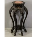 CHINESE CARVED HARDWOOD STAND with inset marble top, hexagonal top detail over six floriate carved