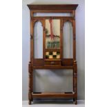 VICTORIAN HALLSTAND - having a central mirror and tiled section, a single drawer and drip trays,