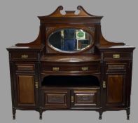 EDWARDIAN MAHOGANY MIRROR BACKED SIDEBOARD - having a bow front and carved detail, 169cms H,