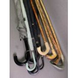 SHEPHERD'S CROOKS with carved fish shaped handles, other sticks and umbrellas
