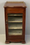 ANTIQUE MAHOGANY MUSIC CABINET with brass galleried top and labelled inner shelves on bracket