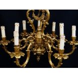 MODERN ITALIAN ROCOCO NINE-LIGHT BRASS CEILING LIGHT, triple acanthus scroll and floral swag centre,