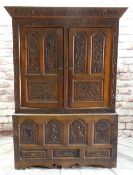 18TH CENTURY JOINED OAK HANGING PRESS, possibly Caernarfonshire, later carved with scrolling