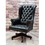 NORWEGIAN LEATHER DESK CHAIR, button upholstered in black with swivel base Condition: arms and