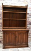 VICTORIAN GOTHIC REVIVAL OAK BOOKCASE ON A BASE, ebony dot-inlaid arcaded top with trefoil finals,