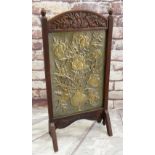 ARTS & CRAFTS EMBOSSED BRASS & OAK FIRE SCREEN, decorated with vase of flowers, foliate carved