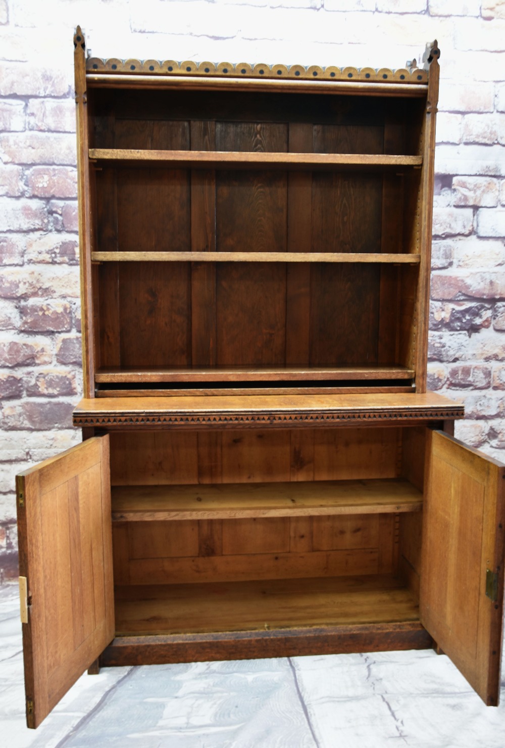 VICTORIAN GOTHIC REVIVAL OAK BOOKCASE ON A BASE, ebony dot-inlaid arcaded top with trefoil finals, - Image 3 of 4