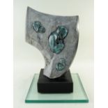 GLENN MORRIS bronze and carved springstone - 'Fossils' on ebonised plinth and plate glass base,