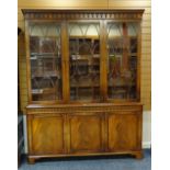 'REPRODUX' MAHOGANY BOOKCASE, arcaded dentil cornice, astragal doors, adjustable shelves, cupboard