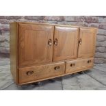 ERCOL 'WINDSOR 468' BLONDE ELM SIDEBOARD, fitted three cupboards over pair apron drawers, casters,