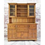 ERCOL ELM INVERTED BREAKFRONT DRESSER, part glazed and shelved upper section on cupboard base fitted