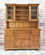 ERCOL ELM INVERTED BREAKFRONT DRESSER, part glazed and shelved upper section on cupboard base fitted