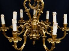 MODERN ITALIAN ROCOCO NINE-LIGHT BRASS CEILING LIGHT, triple acanthus scroll and floral swag centre,