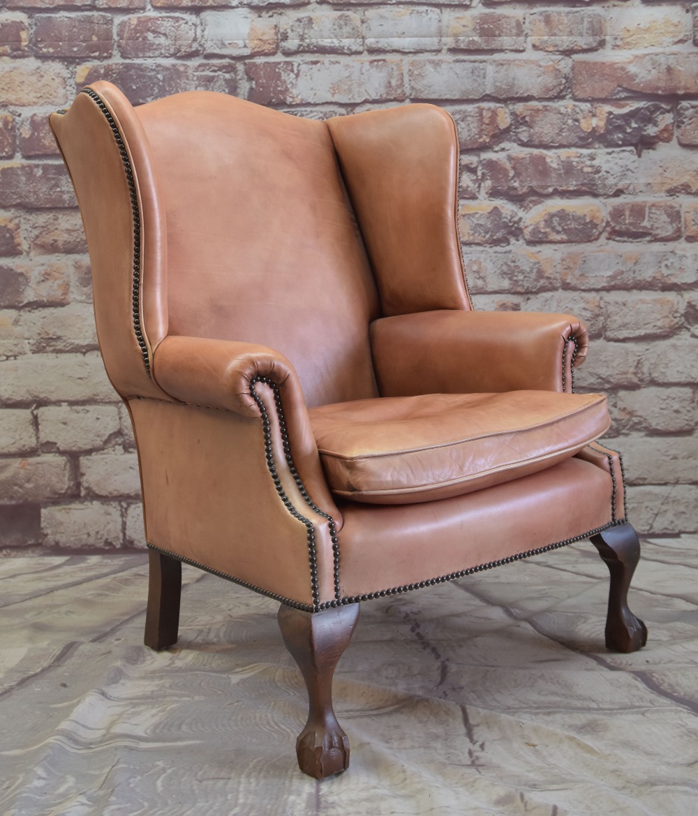 GEORGIAN-STYLE LEATHER WINGBACK ARMCHAIR, close -nailed faded red leather upholstery, claw and