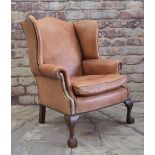 GEORGIAN-STYLE LEATHER WINGBACK ARMCHAIR, close -nailed faded red leather upholstery, claw and