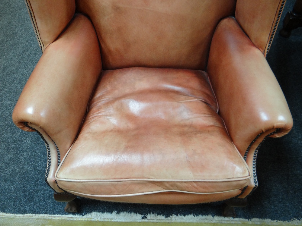 GEORGIAN-STYLE LEATHER WINGBACK ARMCHAIR, close -nailed faded red leather upholstery, claw and - Image 4 of 20