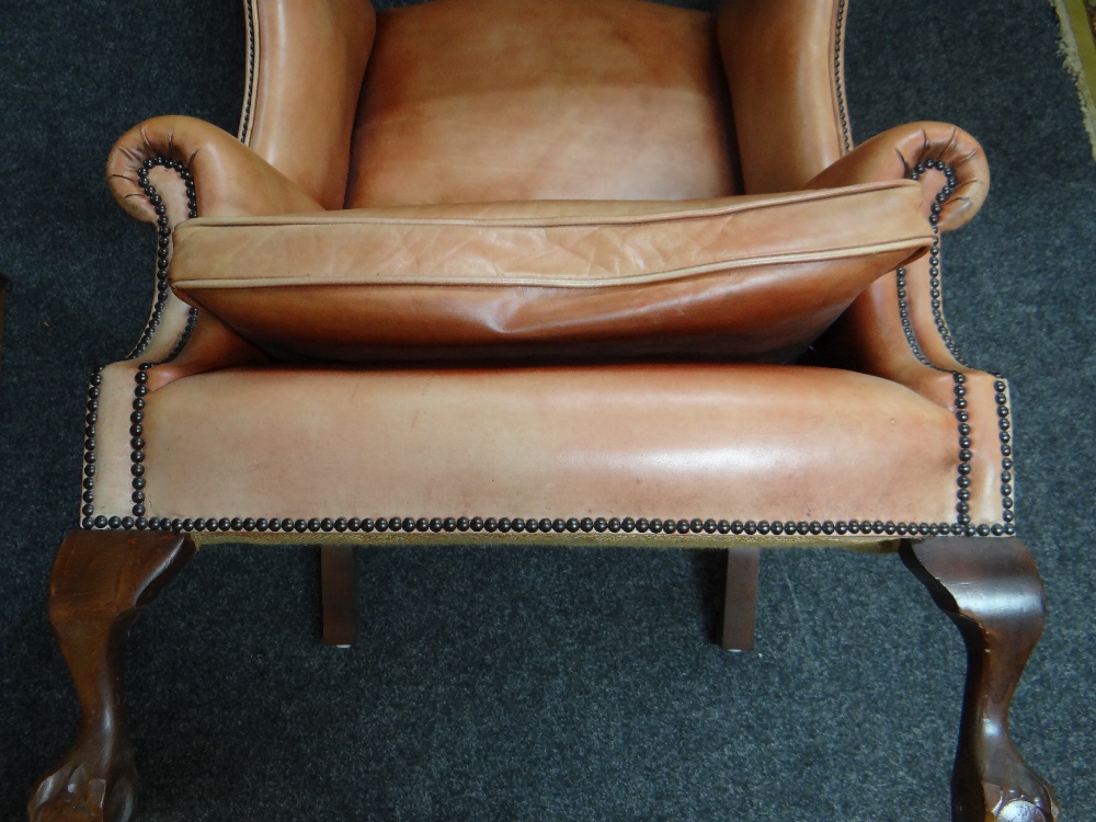 GEORGIAN-STYLE LEATHER WINGBACK ARMCHAIR, close -nailed faded red leather upholstery, claw and - Image 18 of 20