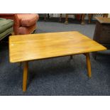 ERCOL GOLDEN ELM COFFEE TABLE, with spindle under tier, blue label, 70 x 99cms