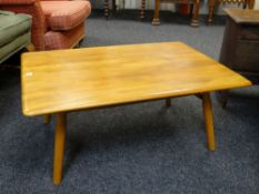 ERCOL GOLDEN ELM COFFEE TABLE, with spindle under tier, blue label, 70 x 99cms
