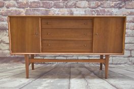 GORDON RUSSELL TEAK SIDEBOARD, narrow rectangular top above cupboards flanking three graduated