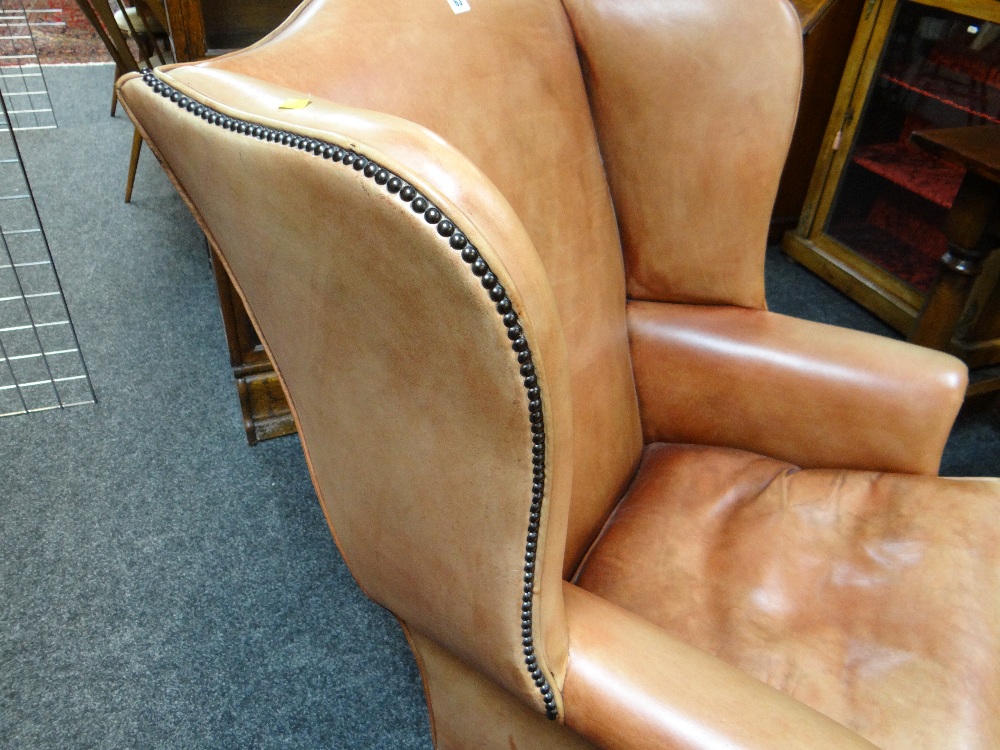 GEORGIAN-STYLE LEATHER WINGBACK ARMCHAIR, close -nailed faded red leather upholstery, claw and - Image 7 of 20