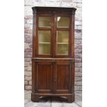 EARLY 19TH CENTURY CARMARTHENSHIRE OAK STANDING CORNER CUPBOARD, cavetto cornice with parcel