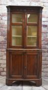 EARLY 19TH CENTURY CARMARTHENSHIRE OAK STANDING CORNER CUPBOARD, cavetto cornice with parcel