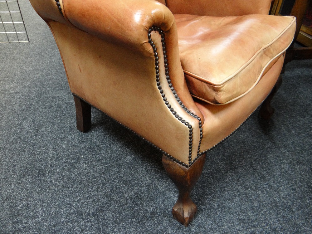 GEORGIAN-STYLE LEATHER WINGBACK ARMCHAIR, close -nailed faded red leather upholstery, claw and - Image 8 of 20