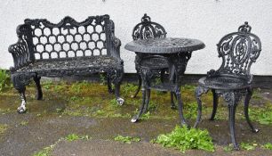 CAST IRON GARDEN FURNITURE, including two-seater bench, circular table and pair of chairs (4)
