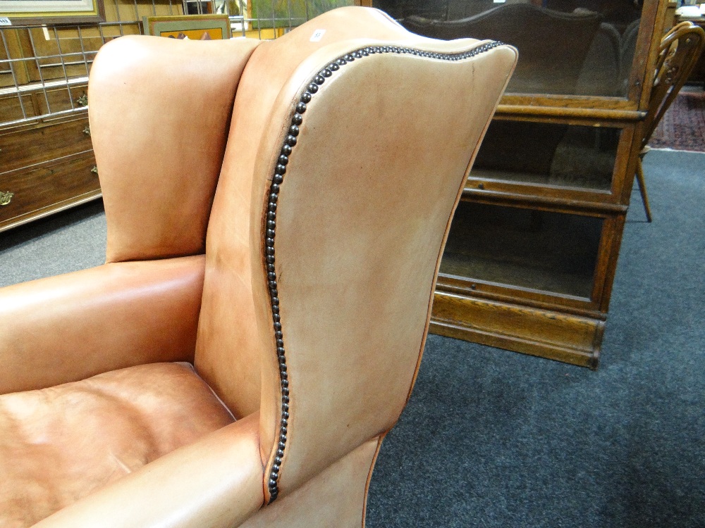 GEORGIAN-STYLE LEATHER WINGBACK ARMCHAIR, close -nailed faded red leather upholstery, claw and - Image 11 of 20