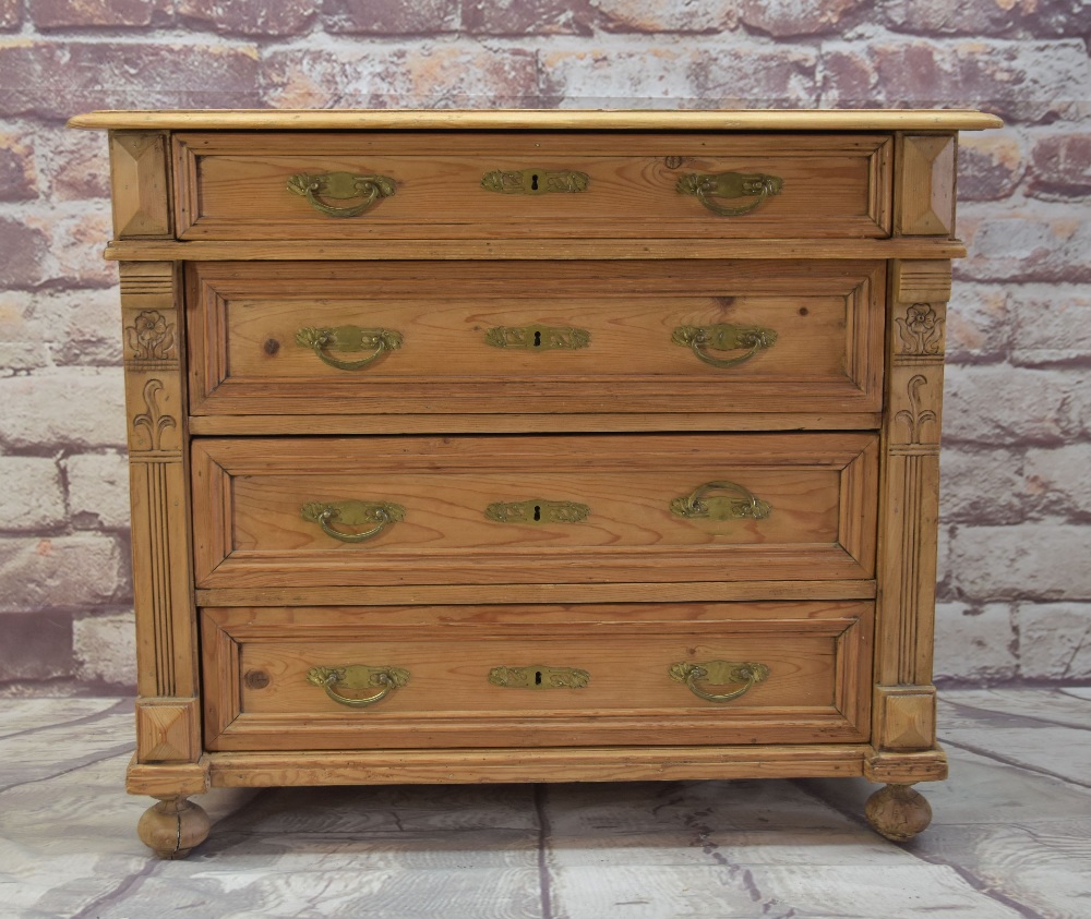 ANTIQUE PINE FOUR-DRAWER COMMODE, with art nouveau handles, moulded drawer fronts, carved