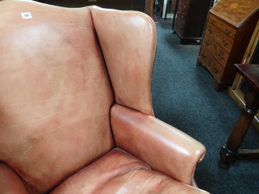 GEORGIAN-STYLE LEATHER WINGBACK ARMCHAIR, close -nailed faded red leather upholstery, claw and - Image 5 of 20