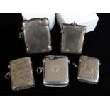 FIVE SIMILAR SILVER VESTA CASES of rectangular form, two plain, three engraved including 'H. M. S.