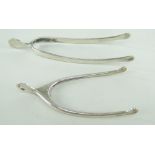 TWO SILVER WISHBONE SUGAR TONGS comprising Edward VII silver Asprey wishbone tongs, London 1902 (