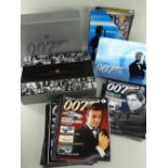 JAMES BOND MOVIE MEMORABILIA: including box of trading cards, associated magazines and an ultimate