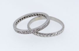 TWO PLATINUM RINGS comprising wedding band of arrow head design together with platinum and diamond