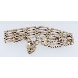 9CT GOLD FIVE-BAR GATE BRACELET, heart shaped padlock, 11.8gms