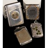 FOUR SILVER VESTA CASES comprising two similar silver and enamel three leaf clover examples,