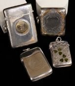 FOUR SILVER VESTA CASES comprising two similar silver and enamel three leaf clover examples,