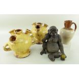 POTTERY FIGURE OF A JUVENILE GORILLA, seated with fruit in his hand, 20cms, salt glazed stoneware