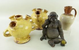 POTTERY FIGURE OF A JUVENILE GORILLA, seated with fruit in his hand, 20cms, salt glazed stoneware