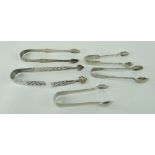 FOUR SILVER SUGAR TONGS comprising two engraved examples, probably 18th century, small Walker & Hall