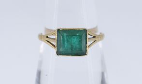 18CT GOLD EMERALD RING, the stone measuring 7 x 6mms approx, ring size N, 2.3gms, in box