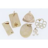 ASSORTED PENDANTS comprising five 9ct gold pendant, two set with tiny diamonds, together with a