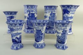 SEVEN CAULDON 'BLUE CHARIOTS' BLUE & WHITE' PRINTED HEXAGONAL SPILL VASES, including five fluted