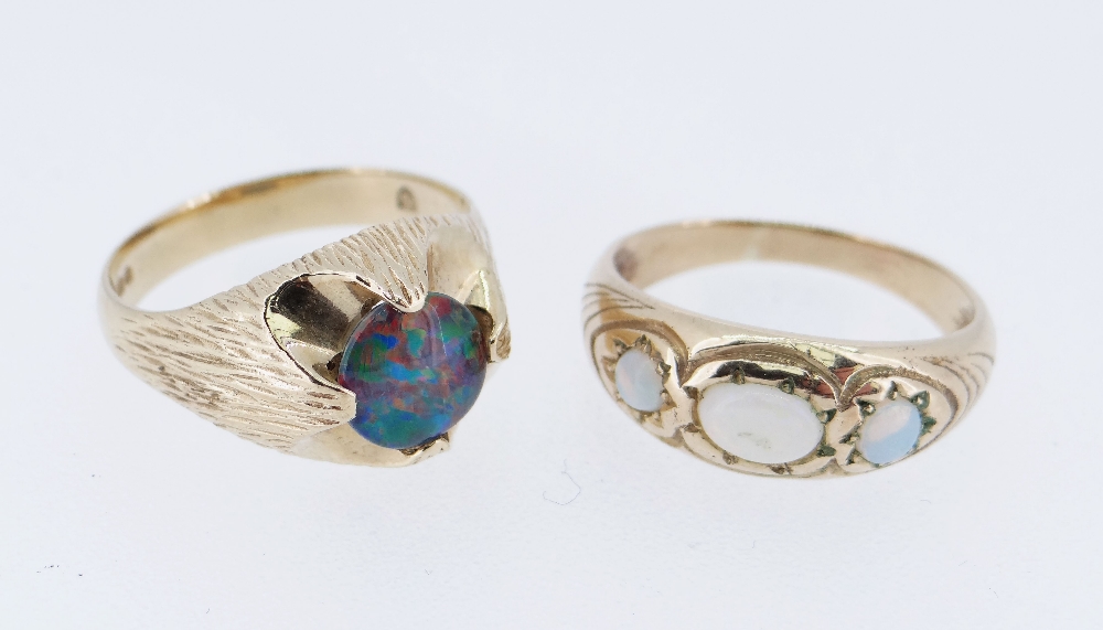 TWO 9CT GOLD OPAL RINGS comprising one set with single black opal triplet (size T) together with