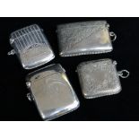 FOUR SIMILAR SILVER VESTA CASES, all of slightly curved form and having engraving of some kind