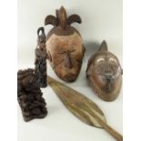 TWO AFRICAN MASKS, comprising carved Baule mask and painted Igbo mask; together with Calabar