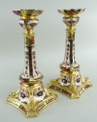 PAIR OF ROYAL CROWN DERBY IMARI CANDLESTICKS, pattern number 1128, printed marks to underside, 26.