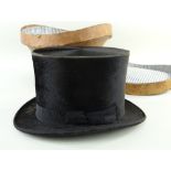 BATTERSBY & CO. (LONDON) TOP HAT, & HATBOX. in leather Comments: Fair, worn along edges, brim worn,